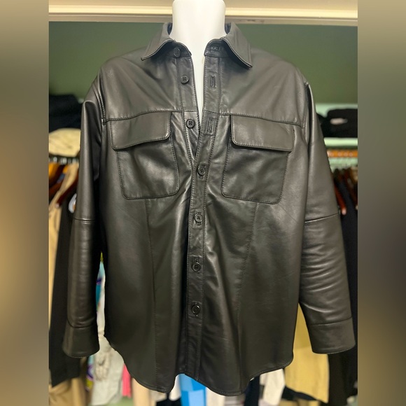 Size medium lamb skin leather shirt with pockets seams in both arms oversize
